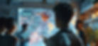 image of a boy looking at a screen 