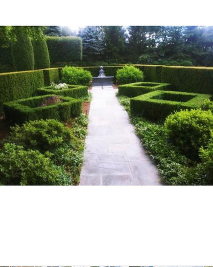 Stone pathway leads to a fountain, surrounded by a Manicured Garden and Landscaped Pathways.
