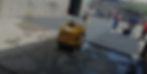 Road construction: Workers paving a road with a small roller