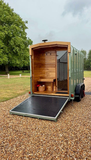 Revivo Sauna's handcrafted wood-fired outdoor sauna set up for a private hire at Minstrel Court wedding venue near Cambridge and Royston.