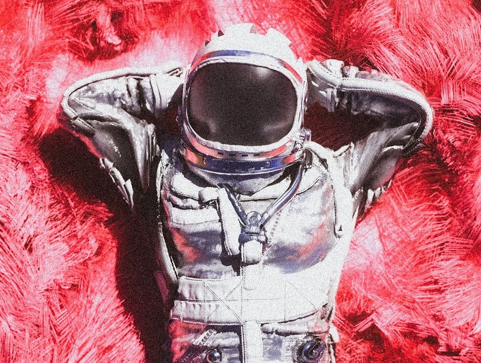 An astronaut relaxing on red plush