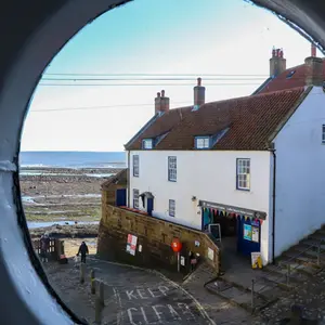 The portholes at Dock Cottage with a view over to the Coastguards