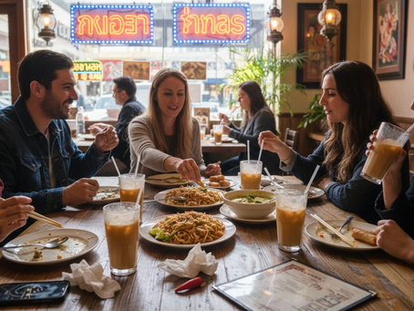 Friends sharing Thai dishes in Las Vegas restaurant