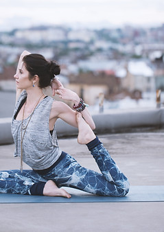 Woman doing a yoga pose outdoors