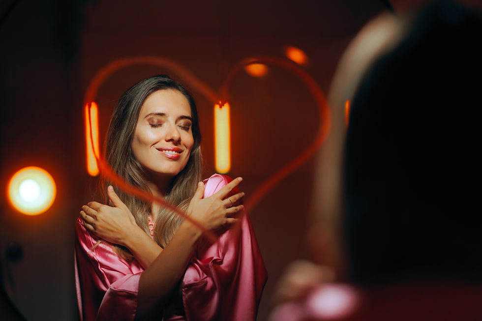 Mirror image of women hugging self with love heart drawn on mirror. Manifesting.