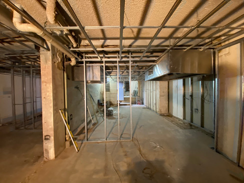 Professional plasterer repairing wall cracks in a Sydney residential property.