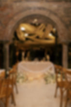 sweetheart table with candles and drapery
