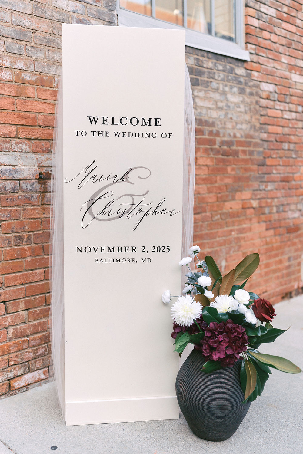 wedding welcome sign with floor arrangement