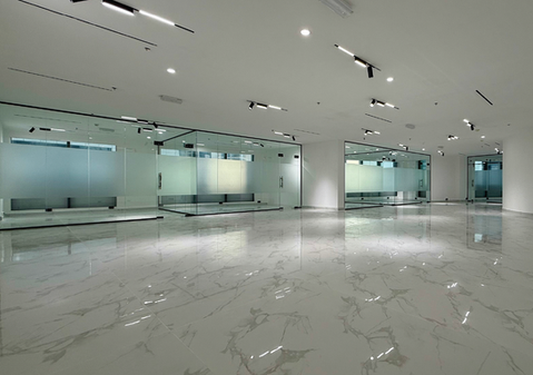 Fully fitted 2,715 sqft office for sale at Regal Tower Business Bay with marble flooring and glass partitions
