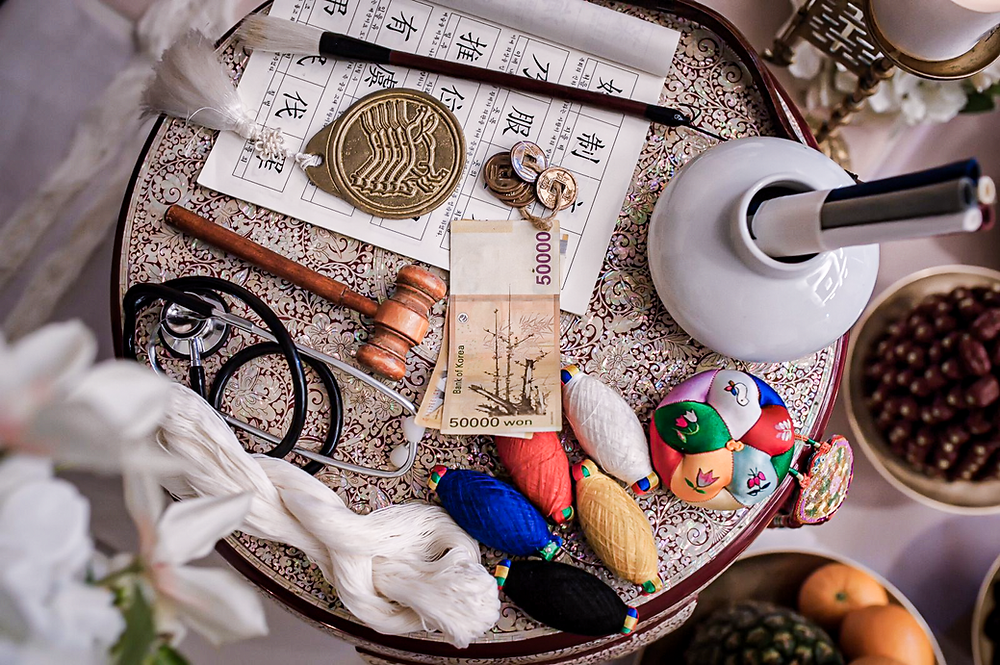 Doljabi — a table of various objects placed in front of the child. They are to pick an object, which symbolizes their future occupation.
