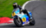 Owen Cherrell riding a RG500 Barry Sheene replica motorcycle.