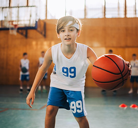 a-junior-basketball-player-is-dribbling-a-ball-dur-2025-04-03-19-46-12-utc.jpg