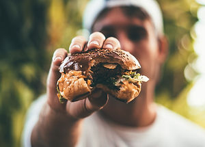 Man Holding Burger