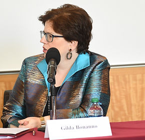 Gilda Bonanno participating in a strategic discussion with a microphone