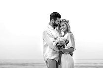 depositphotos_214154262-stock-photo-bride-wedding-bouquet-groom-hugging_edited.jpg