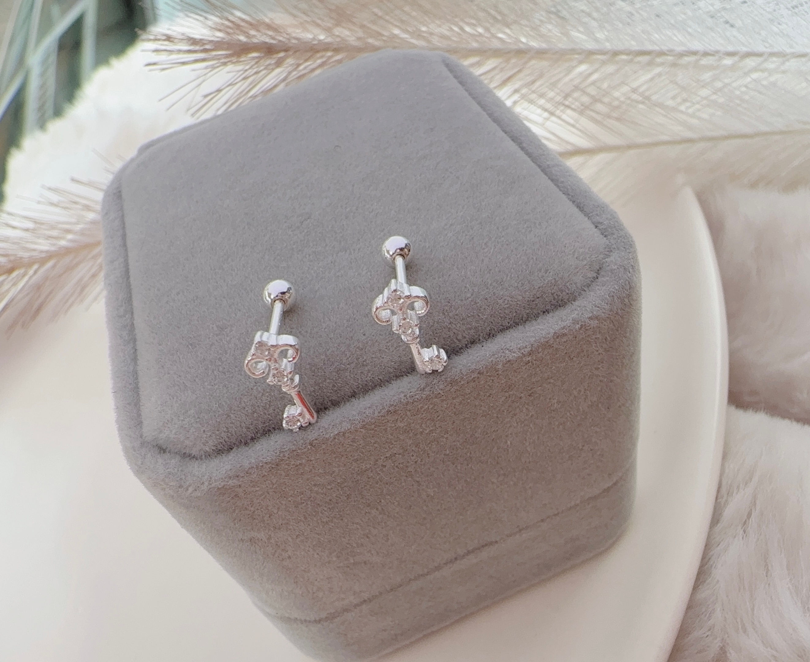 Aretes ortopédicos seguro bolitas llave plata 925