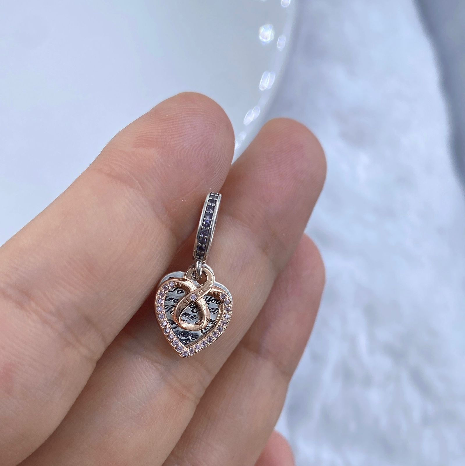 Charm doble infinito de dos tonos plata y baño oro rosa