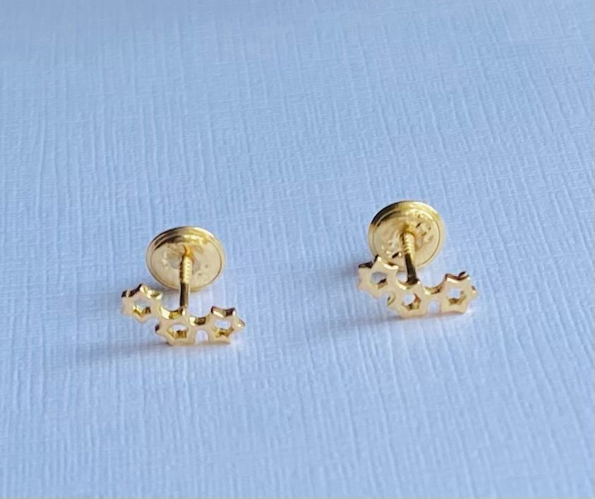 Aretes ortopédicos 3 estrellas oro 750-18k ley