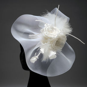 The image features a white flower set against a black background, creating a striking contrast. It may be associated with themes of beauty and simplicity. The tags suggest it could relate to fashion accessories or artistic representations involving clothing.