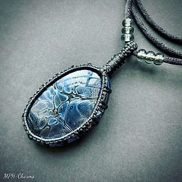 Stone, polyester cord, resin, glass beads