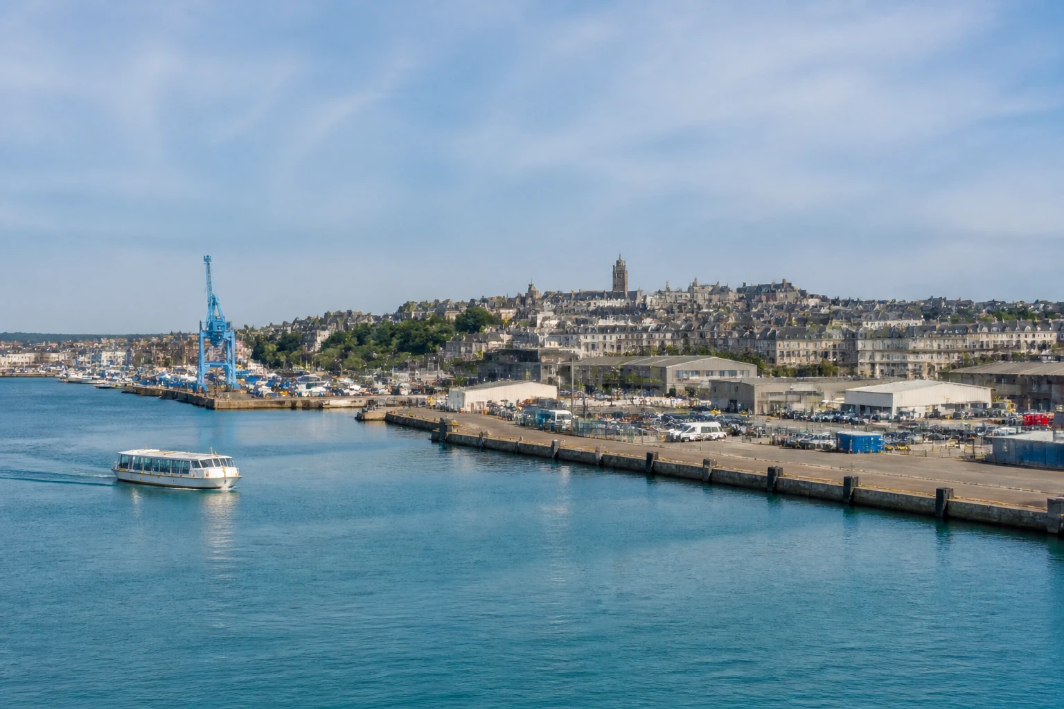 Representative cruise port destination view: Cherbourg, France; passenger waterfront and harbor water, not an exact landmark photograph.
