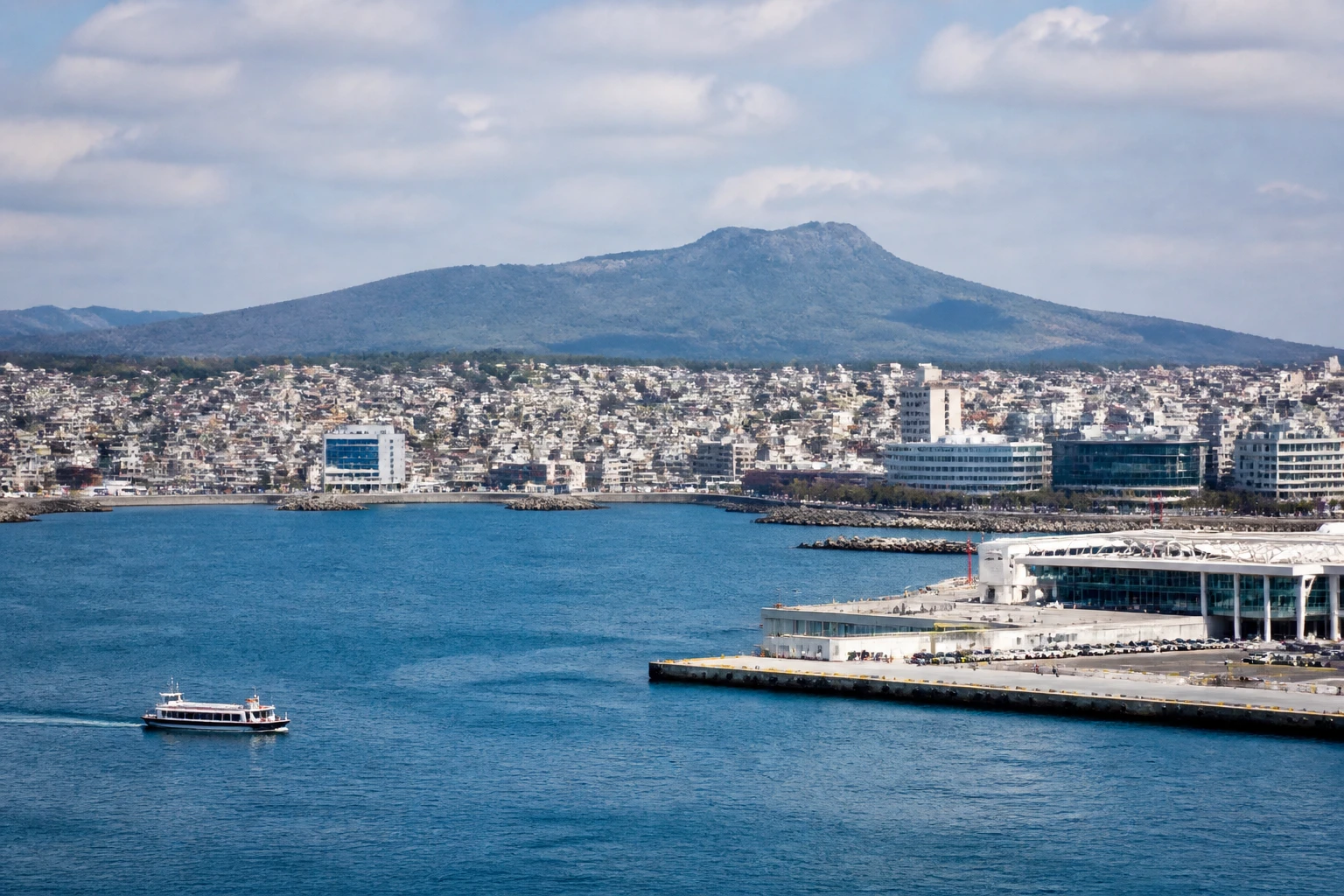 Representative cruise port destination view: Jeju, South Korea; passenger waterfront and harbor water, not an exact landmark photograph.