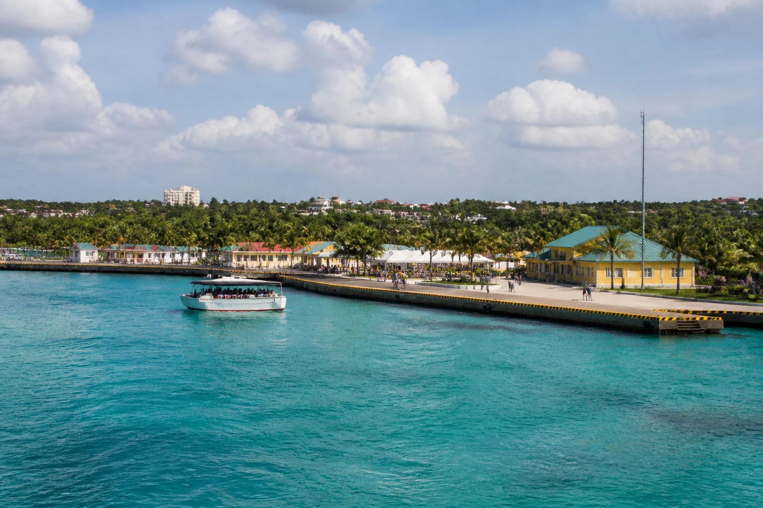 Representative cruise port destination view: CocoCay, Bahamas; passenger waterfront and harbor water, not an exact landmark photograph.