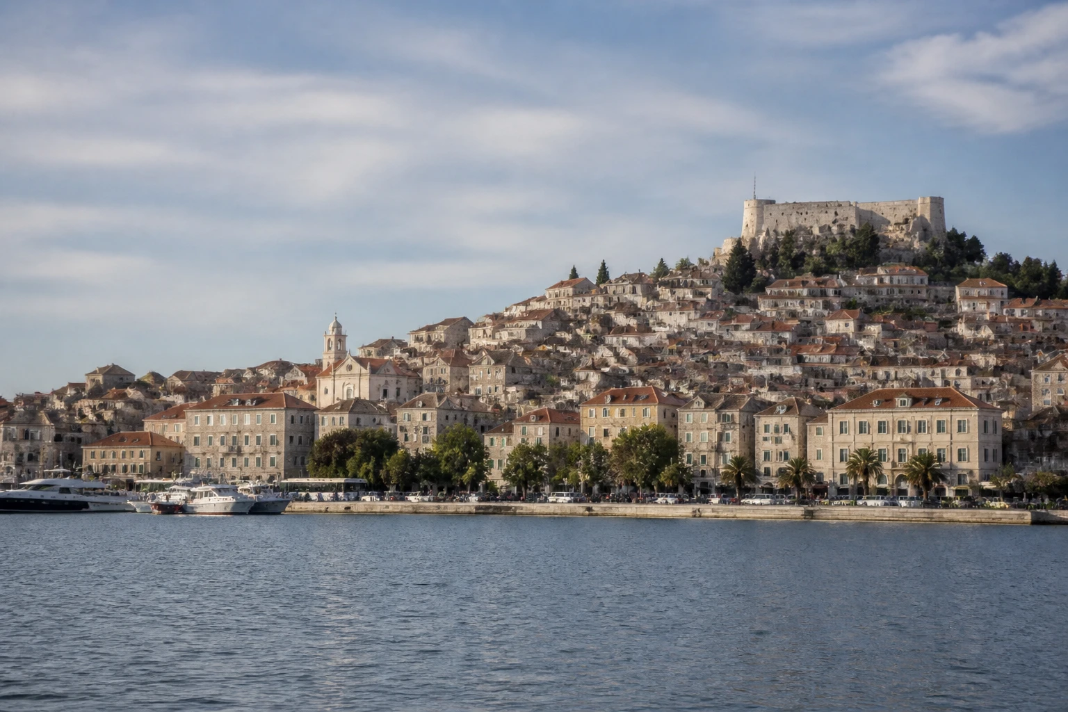 Representative cruise port destination view: Sibenik, Croatia; passenger waterfront and harbor water, not an exact landmark photograph.