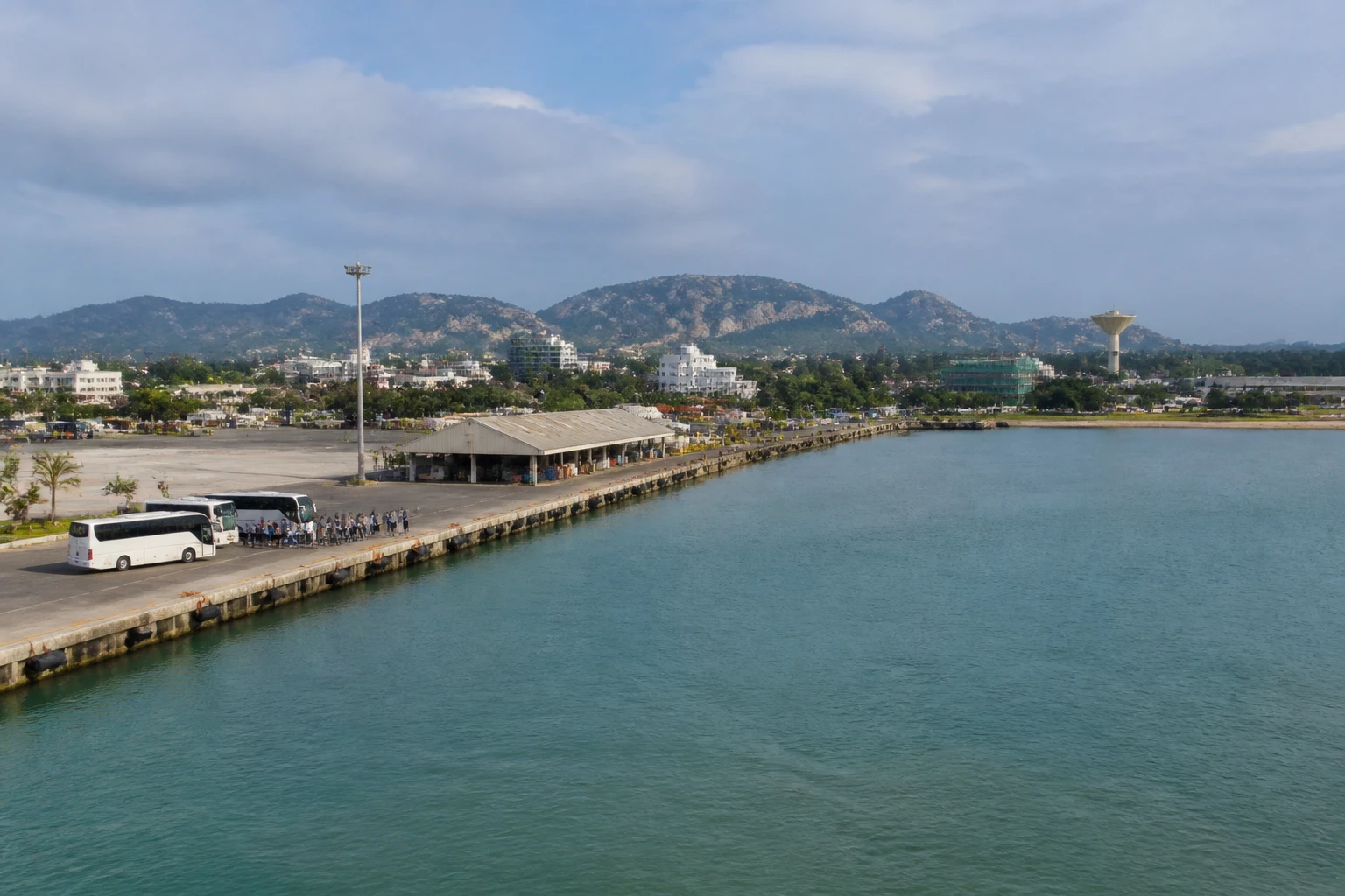 Representative cruise port destination view: Hambantota, Sri Lanka; passenger waterfront and harbor water, not an exact landmark photograph.