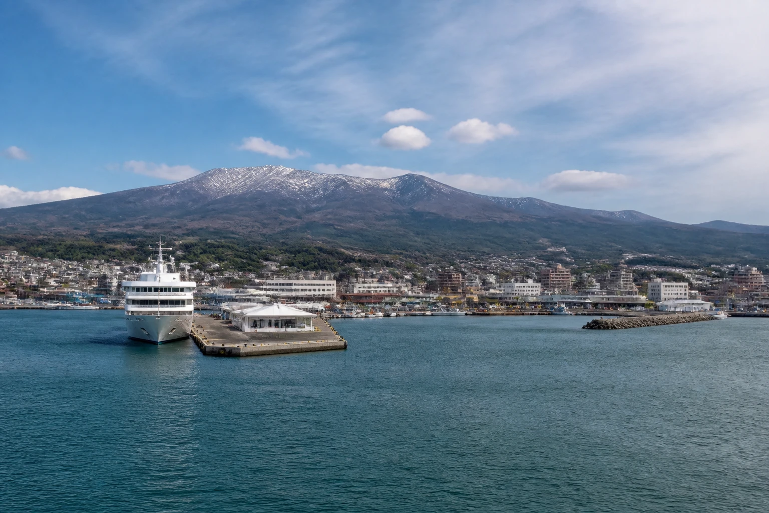 Representative cruise port destination view: Miyako, Japan; passenger waterfront and harbor water, not an exact landmark photograph.