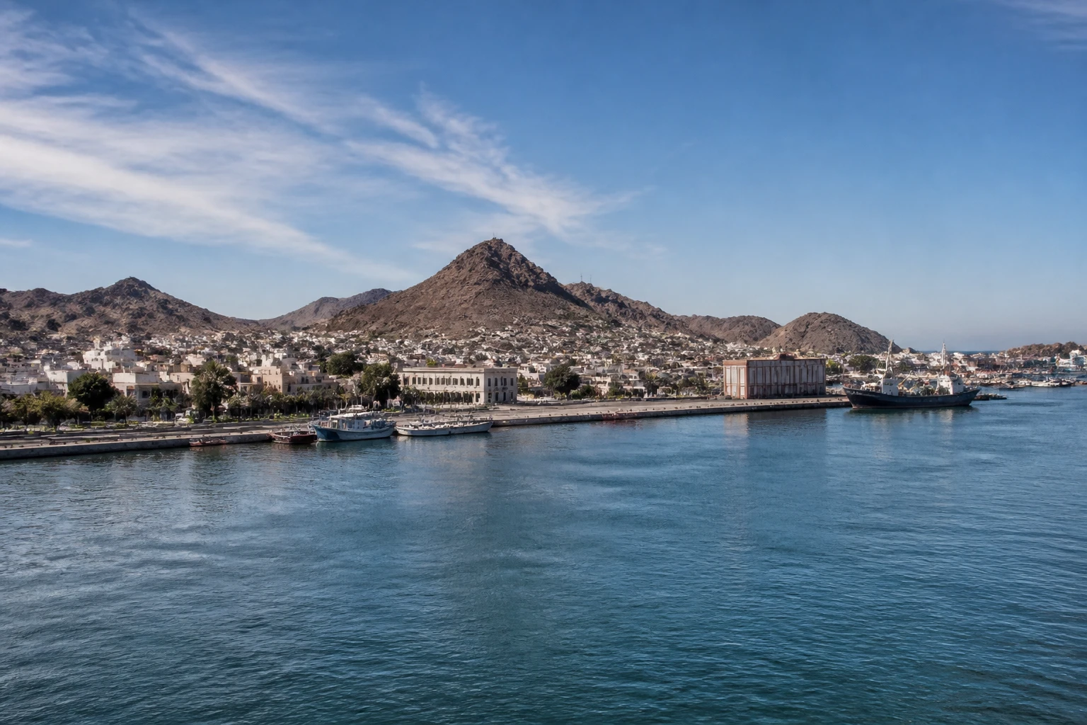 Representative cruise port destination view: Guaymas, Mexico; passenger waterfront and harbor water, not an exact landmark photograph.