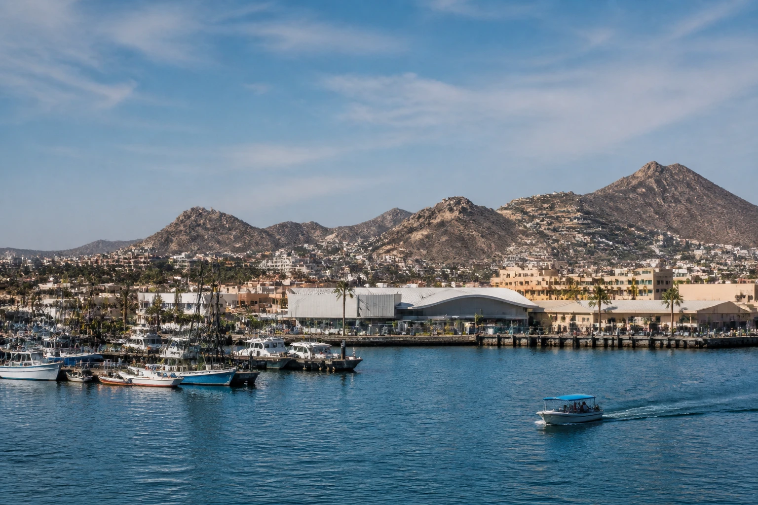 Representative cruise port destination view: Cabo San Lucas, Mexico; passenger waterfront and harbor water, not an exact landmark photograph.