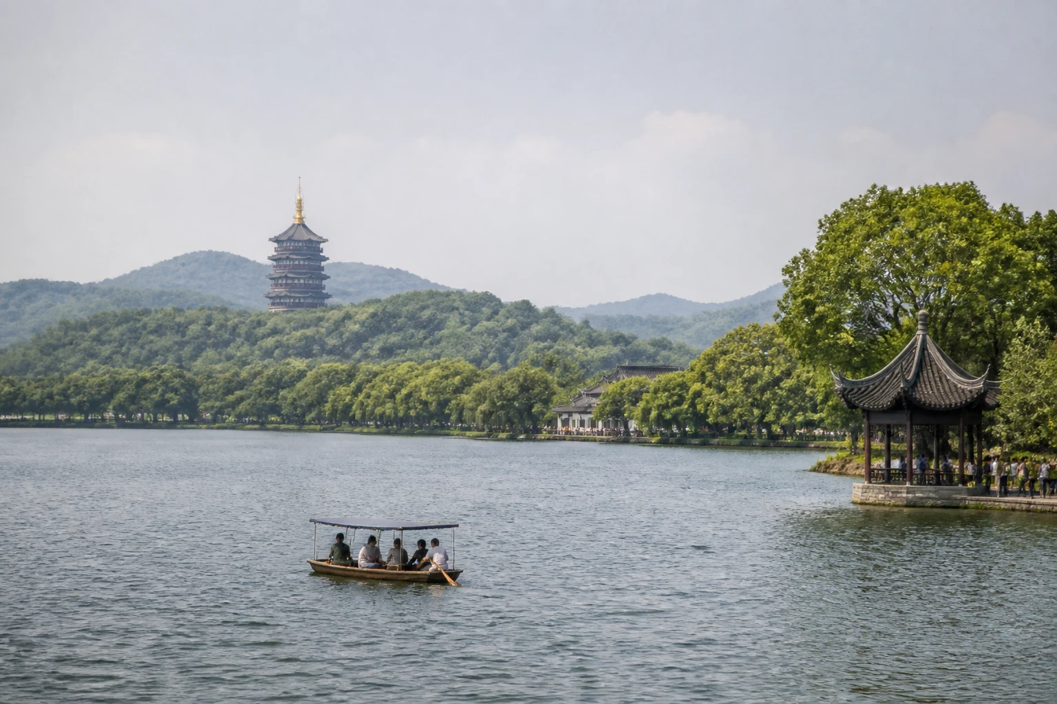 Representative lake destination view of Hangzhou in China, with inland water, regional terrain, vegetation, and natural light; not an exact landmark photograph.