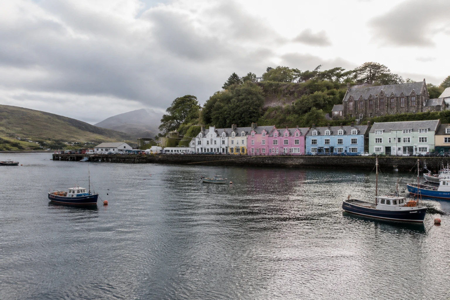Representative cruise port destination view: Portree, United Kingdom; passenger waterfront and harbor water, not an exact landmark photograph.