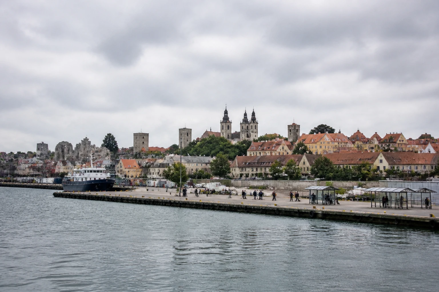 Representative cruise port destination view: Visby, Sweden; passenger waterfront and harbor water, not an exact landmark photograph.