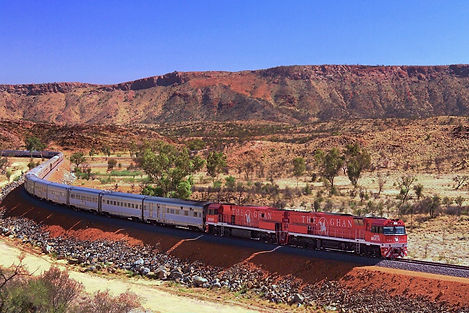 The Ghan train crossing Australia's red Outback, a destination or experience featured on the Spectacular Australia with the Historic Ghan Train tour