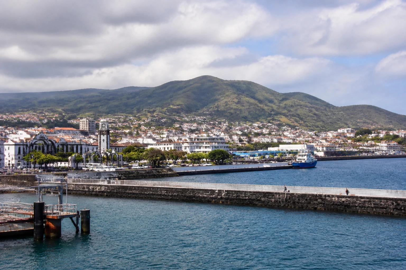 Representative cruise port destination view: Ponta Delgada, Portugal; passenger waterfront and harbor water, not an exact landmark photograph.
