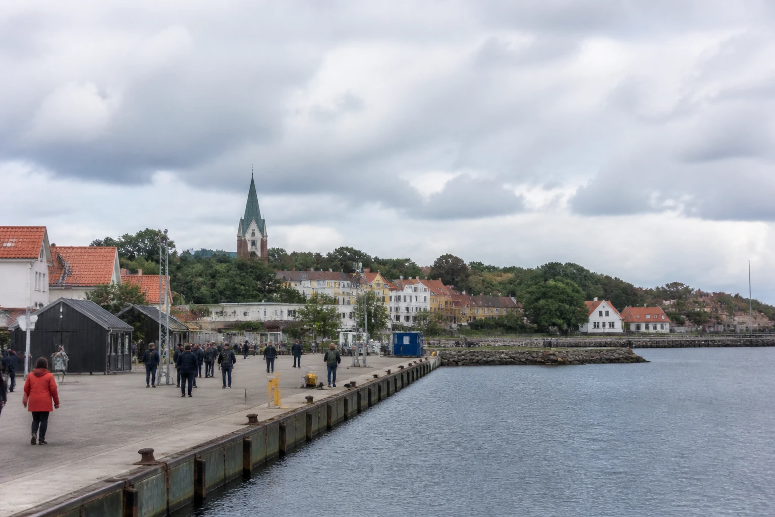 Representative cruise port destination view: Ronne, Denmark; passenger waterfront and harbor water, not an exact landmark photograph.