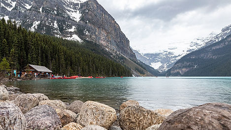 turquoise Lake Louise beneath the Canadian Rockies in Alberta, a destination or experience featured on the Great Resorts of the Canadian Rockies with Rocky Mountaineer tour