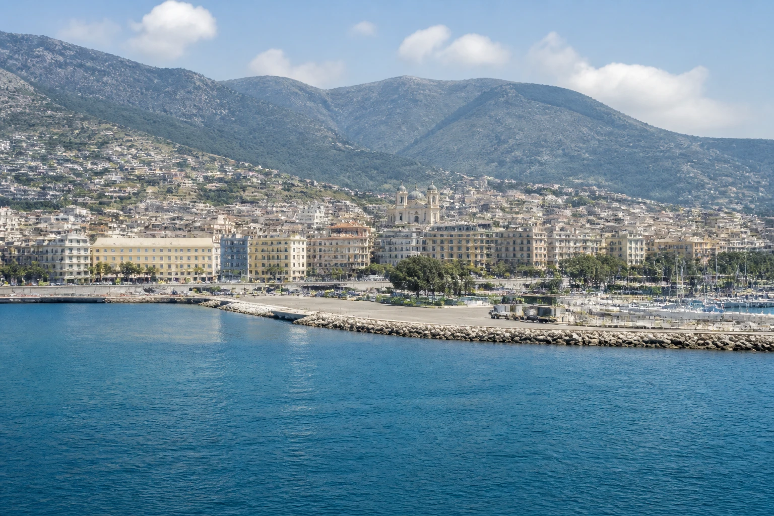 Representative cruise port destination view: Bastia, France; passenger waterfront and harbor water, not an exact landmark photograph.