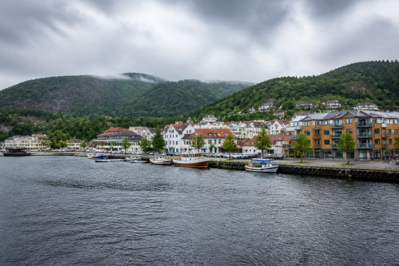 Representative cruise port destination view: Mandal, Norway; passenger waterfront and harbor water, not an exact landmark photograph.