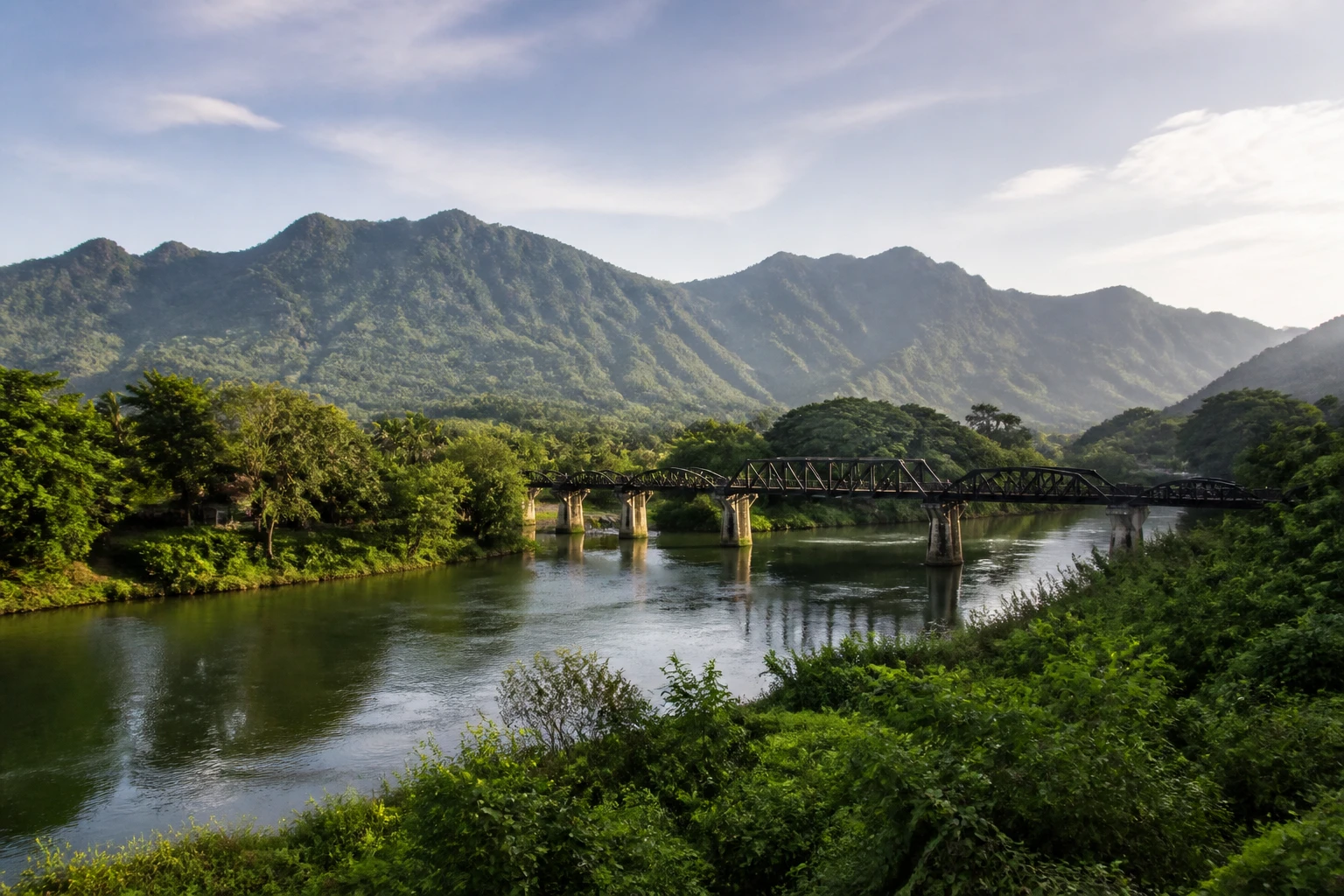 Representative nature destination view of Kanchanaburi in Thailand, with regional terrain, vegetation, and natural light; not an exact landmark photograph.
