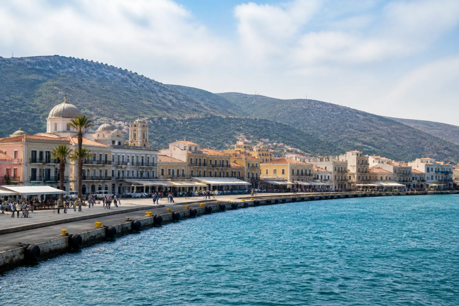 Representative cruise port destination view: Khios, Greece; passenger waterfront and harbor water, not an exact landmark photograph.