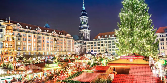 Illuminated holiday decorations and Christmas market stalls in Dresden & the World’s Oldest Christmas Market.