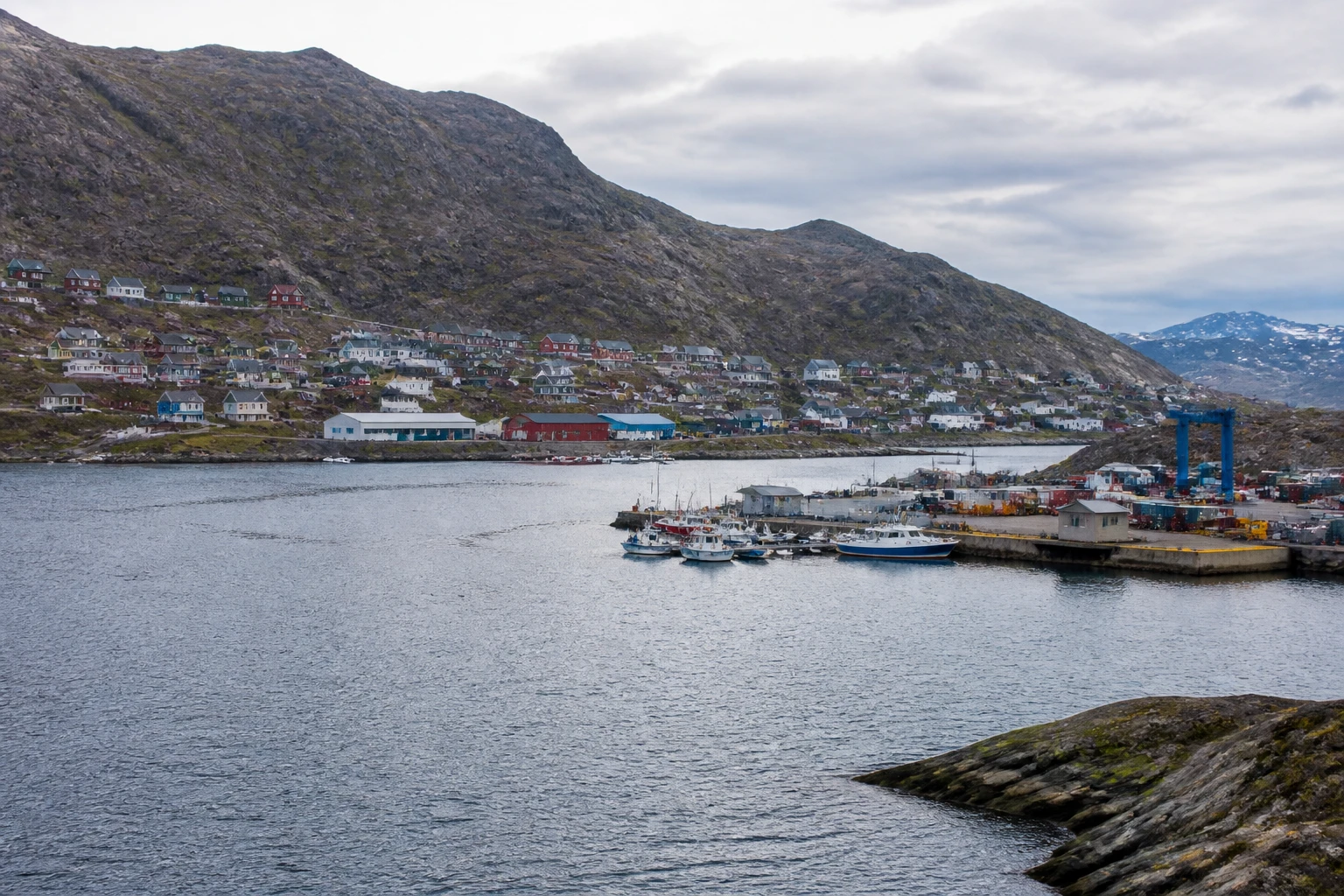 Representative cruise port destination view: Narsaq, Greenland; passenger waterfront and harbor water, not an exact landmark photograph.