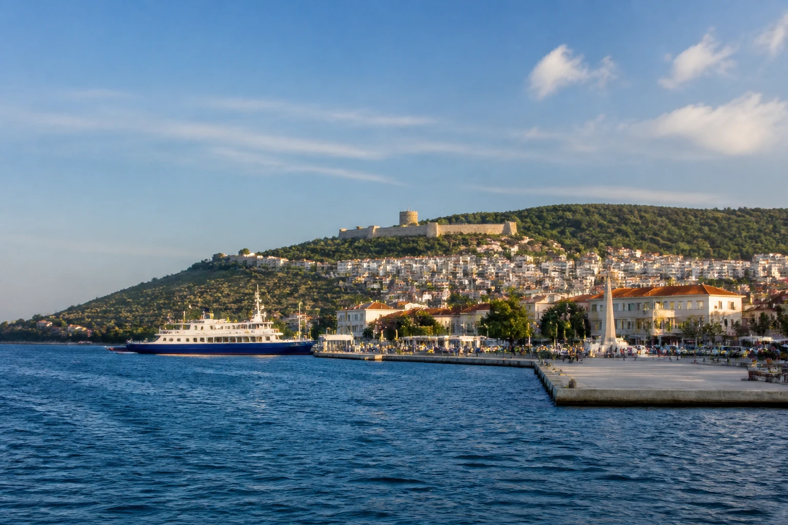 Representative cruise port destination view: Canakkale, Turkiye; passenger waterfront and harbor water, not an exact landmark photograph.