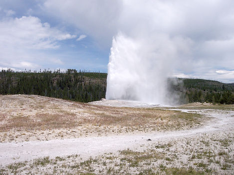 Old Faithful geyser erupting in Yellowstone National Park, a destination or experience featured on the America's National Parks tour
