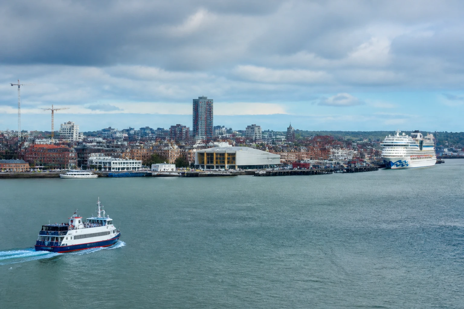 Representative cruise port destination view: Southampton, United Kingdom; passenger waterfront and harbor water, not an exact landmark photograph.