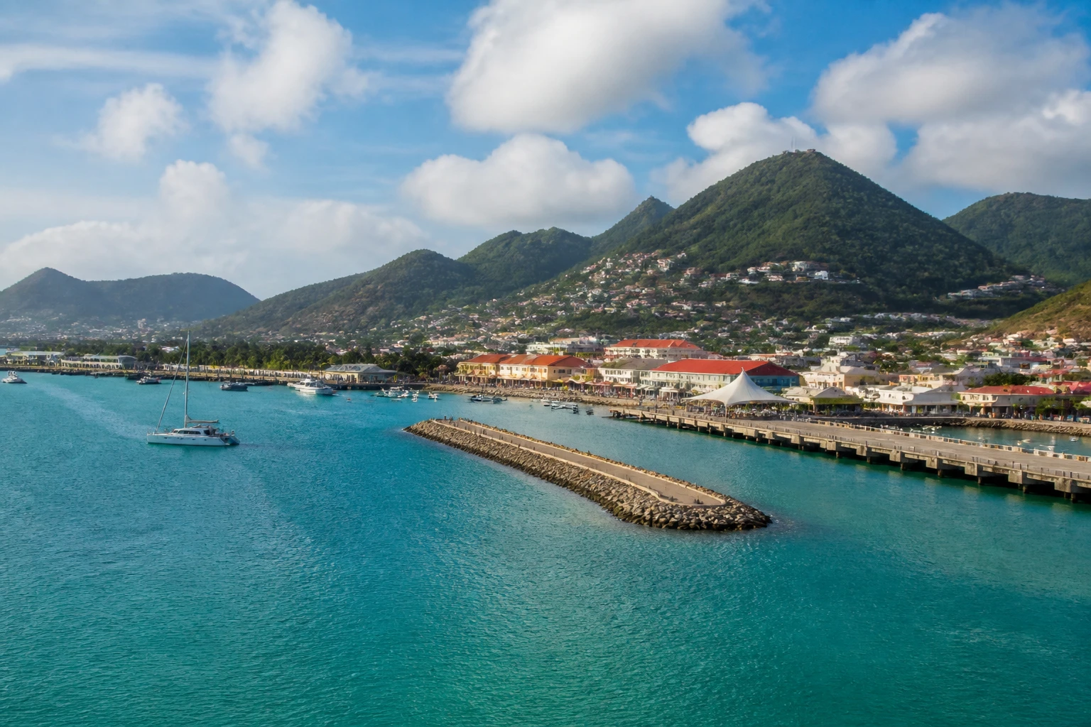 Representative cruise port destination view: Philipsburg, Sint Maarten; passenger waterfront and harbor water, not an exact landmark photograph.