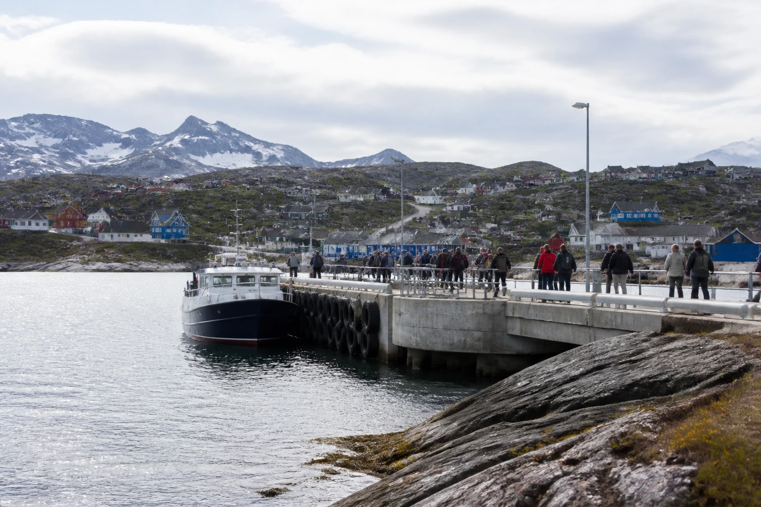 Representative cruise port destination view: Nanortalik, Greenland; passenger waterfront and harbor water, not an exact landmark photograph.